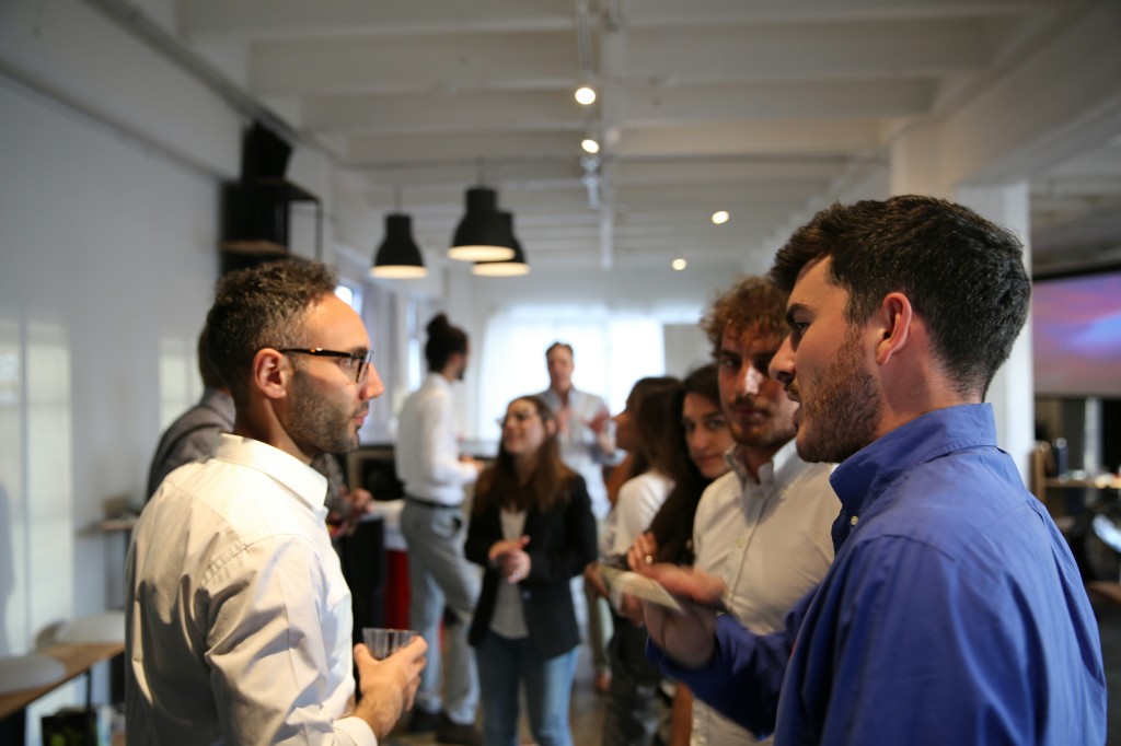 Professionals collaborating in a modern open office environment